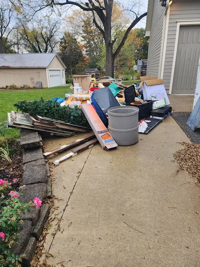 Dumpster being loaded with debris for 3 Yard Dumpster Rental in Binghamton